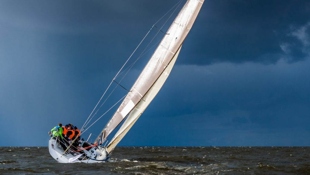 Sailing yacht going before storm.